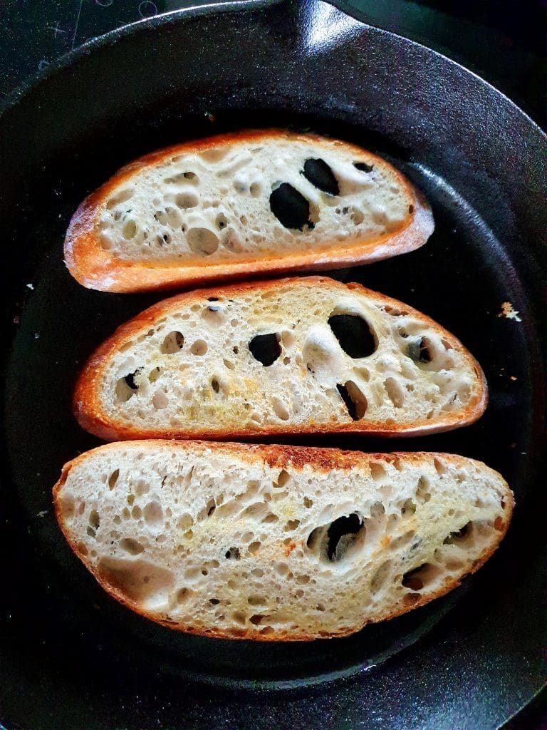 Sourdough Bruschetta dry-grilled in cast-iron pan.